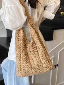 Minimalist woven crochet tote bag with hollow pattern for summer beach vacations
