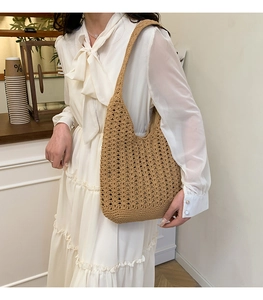 Detail shot of the khaki handmade crochet tote bag featuring intricate openwork hollow textures
