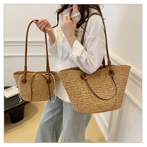 Summer woven straw tote and drawstring bucket bag with brown PU handles for seaside vacation