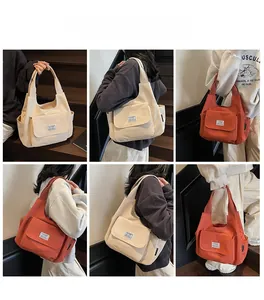 Detailed views of high-capacity canvas shoulder bags in beige and orange for daily commute
