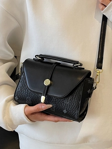 Classic black square handbag with embossed texture, gold hardware and adjustable strap