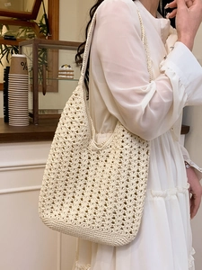 Minimalist beige crochet woven tote bag with hollow geometric patterns for casual summer style