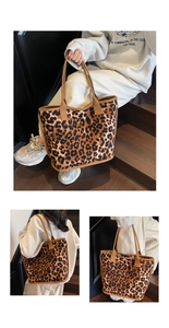 Detail view of leopard print tote bag with brown fabric straps and spacious interior