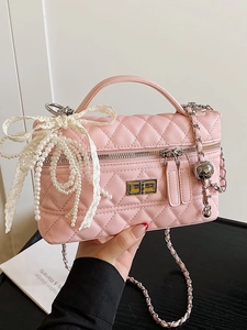Pink quilted crossbody box bag with lace bow and pearl chain straps for women