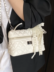 White quilted crossbody bag with lace bow, pearl charms and metal chain strap for women