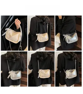 Detail shots of off-white and silver soft leather pillow bags with lace bows and pearl chains