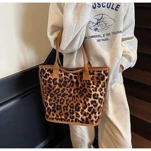 Leopard print tote bag close-up showing durable canvas texture and brown fabric handle