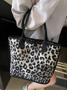 Leopard print tote bag with black trim and large capacity for casual commuting wear