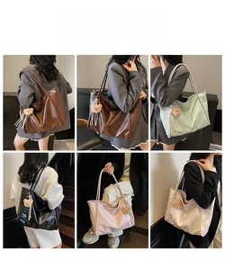Detail view of large soft leather tote bags in five macaron colors with cute bear charm