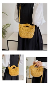 Detail of a bright yellow hand-woven crochet crossbody bag with unique petal patterns
