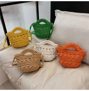 Detail of five mini crochet bags in yellow green cream oatmeal and orange colors