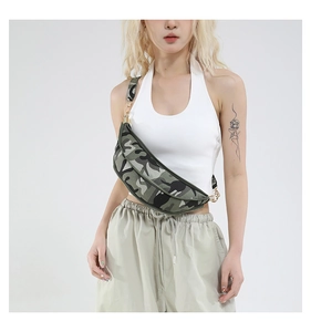 Detail of trendy camouflage crescent bag with golden metal zipper and wide canvas strap