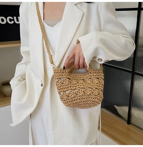 Detail of hand-woven straw tote bag showing tight texture and circular top handle