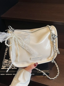 Cream white leather pillow bag with lace bow and pearl chain strap for urban women