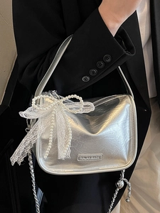 Silver metallic pillow bag with large lace pearl bow and stylish chain strap for women