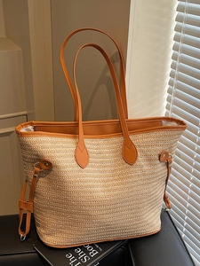 Straw woven tote bag with orange-brown leather handles and large capacity design