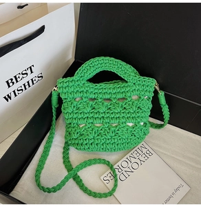 Detail of green woven bucket bag featuring intricate crochet mesh texture and shoulder strap