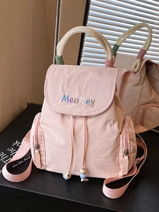 Pink minimalist nylon mini backpack with Mea Rey embroidery and rope handle details
