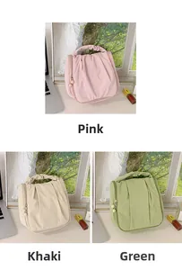 Detail of ruched PU leather handbags with pearl zipper and ruffle handle in three colors