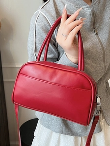 Minimalist red Boston shoulder bag with dual handles and smooth PU leather finish