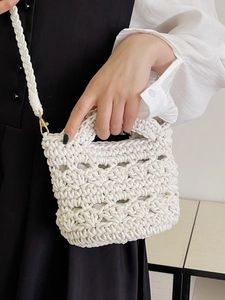 White woven hollow knit bucket bag with handle and crossbody strap for women