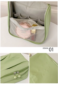 Detail of waterproof green makeup bag featuring pearl zipper pulls and mesh pockets