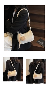 Detailed view of white glossy patent leather shoulder bag with a cute brown teddy bear charm