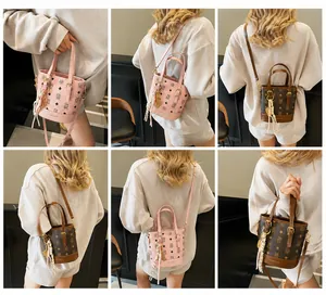 Detailed views of printed bucket bags in pink and brown with monogram pattern and straps