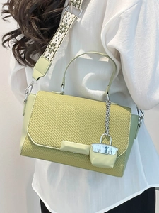 Avocado green PU leather handbag with woven texture and ethnic embroidered wide strap