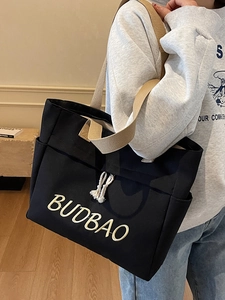 Minimalist black canvas tote bag with BUDBAO embroidery and rope drawstring details