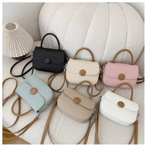 Collection of six embossed square handbags in various colors with brown shoulder straps