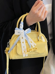 Stylish yellow leather Boston bag with blue checkered ribbon and sweet lace details