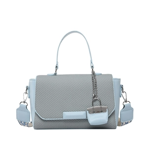 Chic light blue crossbody square bag with grey textured flap and patterned wide strap