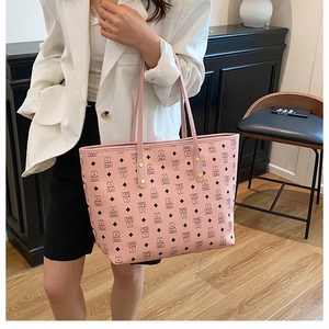 Detail of pink tote bag with cartoon bear print and PU leather shoulder straps