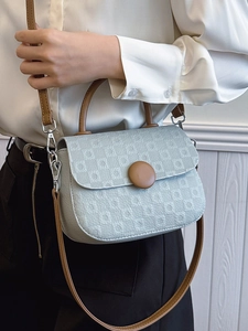 Minimalist light green checkerboard crossbody bag with brown round buckle and strap