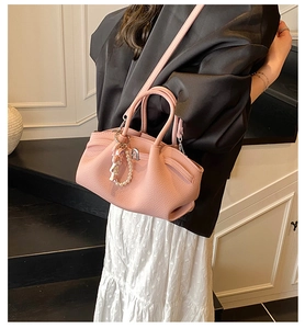 Pink pleated handbag with lychee texture featuring a pearl chain and cute doll charm