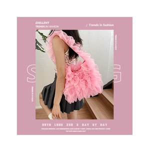 Detail of pink layered ruffle lace shoulder bag with soft textured mesh fabric style