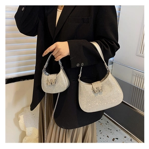 Detailed comparison of small and large silver rhinestone hobo bags with metallic W buckle