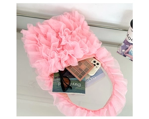 Detailed top view of pink ruffled tulle tote bag interior with smooth satin lining