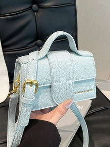 Mini ice blue litchi pattern handbag with gold hardware and adjustable strap