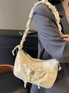 French style hobo shoulder bag in cream satin with pleated strap and bow detail