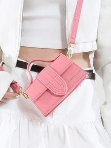 Pink mini crossbody bag in lychee pattern faux leather with gold hardware for women