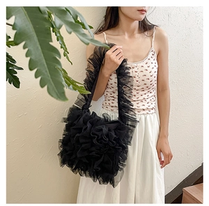 Detail shot of black layered mesh ruffles on a lightweight Japanese-style tote bag