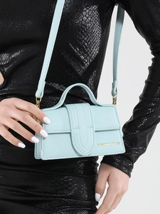 Mini mint green litchi texture crossbody bag with gold logo and top handle for women