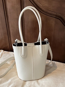 White lychee pattern leather bucket bag with handle and adjustable shoulder strap