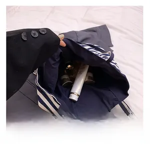 Macro shot showing large storage capacity of the blue striped tote bag with cosmetics