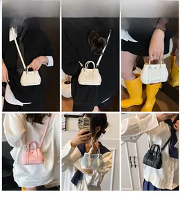 Detail view of mini litchi texture handbags in white pink blue and black colors