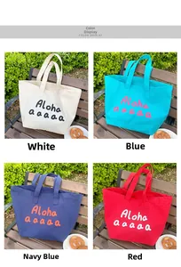 Detail of four canvas tote bags in white, blue, navy and red with Aloha lettering