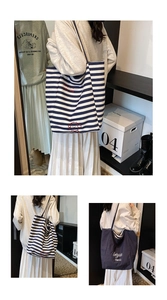 Detail view of spacious canvas tote bags in navy blue and classic nautical stripes