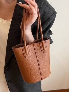 Minimalist dark brown litchi pattern bucket bag for women office commuting style